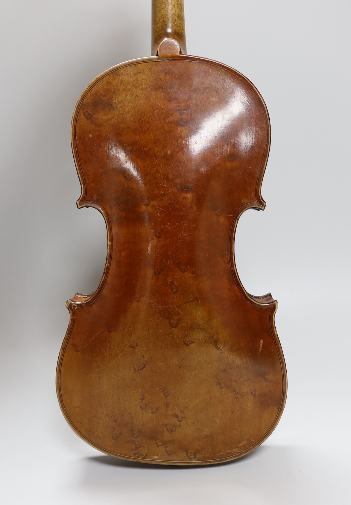 A cased three quarter size violin, labelled E.Coiffier, 56cms long